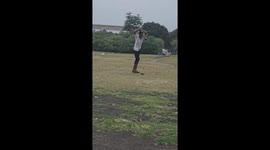 Man Falls While Throwing a Shot Put Ball