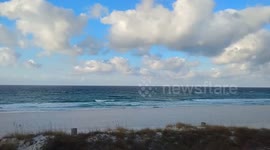 Windy morning surf conditions in Panama, Florida, United States