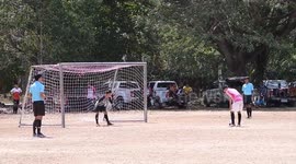 Penalty kick fail sees football crash back off post and knock over embarrassed player