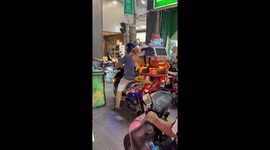 Pet corgi enjoys a scooter ride from the comfort of its cage