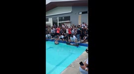 Remote controlled boat owners have race in swimming pool