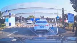 Cyclist knocked down by barrier while trying to slip through gate