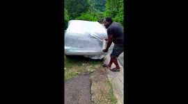 Shrink Wrapping Car To Protect From Hurricane Mellissa