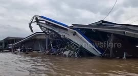Cargo ship crashes into three riverside homes in Thailand