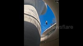 'Floating' cleaner appears to sweep the sky in baffling optical illusion