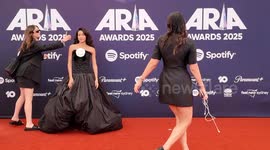 Singer Olivia Dean arrives on the red carpet for the 2025 ARIA Awards, Sydney, Australia