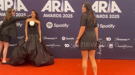 Singer Olivia Dean arrives on the red carpet for the 2025 ARIA Awards, Sydney, Australia