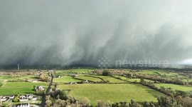 Snow curtains below across the northern ireland countryside during arctic air blast for uk