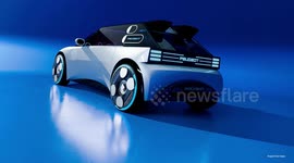 UNCAPTIONED: Light show on wheels: Peugeot unveils futuristic concept with micro-led face, butterfly doors and a video-game steering wheel