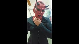 Woman Takes Off Latex From Devil Costume