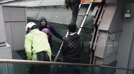 Climate activists unfurl banner over railway station in Italy