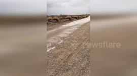Rare flash flood washes over dried out lake in California