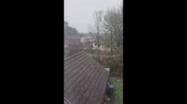 Intense snowfall blankets backyard in London, UK