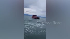 Tourists flee sinking ferry struck by waves in southern Thailand