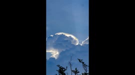 Beautiful cloud irridescence seen above homes in Thailand