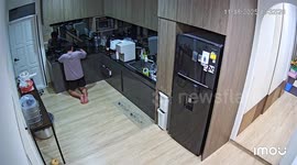 Stove bursts into flames while husband tries to clean it