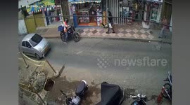 Mother and baby nearly run over after fall in front of moving lorry