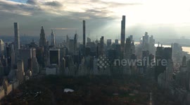 Hazy evening light blankets New York City as sun sets