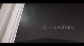 Mystical and eerie sight taken in Tacoma, Washington as fog races across the landscape illuminated by porch lights making it look like a blizzard without any snow!, Washington USA.