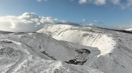 Drone footage shows snow-covered mountains in Northern Ireland as cold snap hits UK