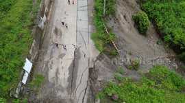 Landslide aftermath seen from the air above valley in the Philippines