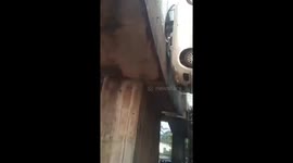 Car plunges from bridge and gets stuck between two pillars