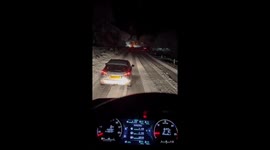 Truck stuck on icy narrow road creates long traffic buildup in Scotland, UK