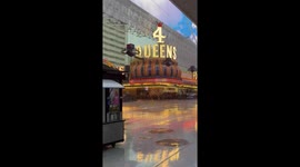 Vibrant nightlife under heavy rain at Fremont Street, Las Vegas, USA