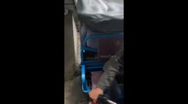 Skilled maneuver of electric 3-wheeler on narrow slope, Zhejiang, China