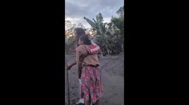A powerful pyroclastic surge from Mount Semeru blankets an entire village, forcing residents to flee for their lives. Amid the chaos, a 65-year-old woman breaks down in tears after losing her home and a close family member. The footage captures the raw af