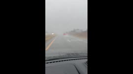 Heavy rain reducing visibility on I-35 South in Edmond, Oklahoma, USA