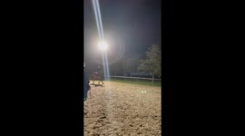 Rider falls during nighttime jumping exercise in Castelnaudary, France