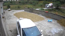Two cement mixers overturn outside family's home in China