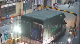 Truck hits height-limit bar in Guangzhou, China