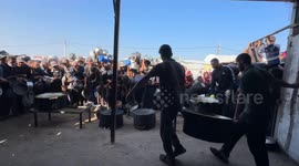 Displaced Gazans line up for hot meals as shortages continue