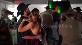 Bride and Groom are Dancing at a Wedding Reception, and the Groom Falls Over