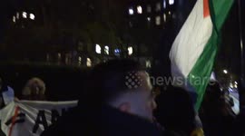 Pro Palestinian protesters sing at a tense St John’s Wood demonstration while pro Israel protesters stand opposite behind a police line.