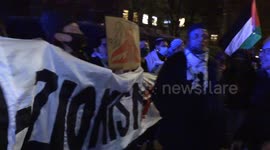 Pro Palestinian protesters chant outside St John’s Wood police station during a tense evening in North London.