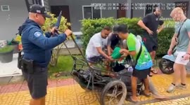Drunk woman wheeled back to hotel in vegetable cart by helpful police in Thailand