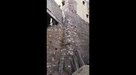 House wall collapses in front of shocked neighbours in India