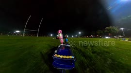Kind local uses remote controlled car to give flowers to strangers in park