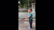 Toddler takes hulking bull twice as tall as him for a walk