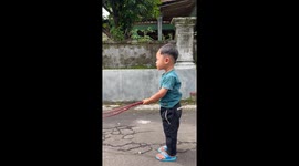 Toddler takes hulking bull twice as tall as him for a walk