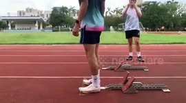 Athlete slips on track as starting blocks slide out of place