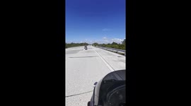 Biker Dodges Car and Dangerous Sign by an Inch