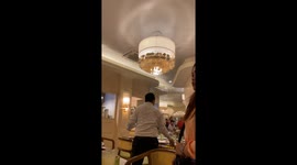 Rain pours through restaurant's leaky roof