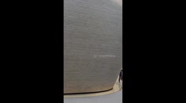 Visitors astonished as cleaner appears to float while wiping glass roof in China