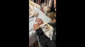 Baby mimics salute for the first time in Guizhou, China