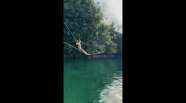 Girl tries to cross two rope bridge but falls in the water