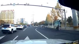 Motorist swerves to avoid child thrown from 3-wheeler in China